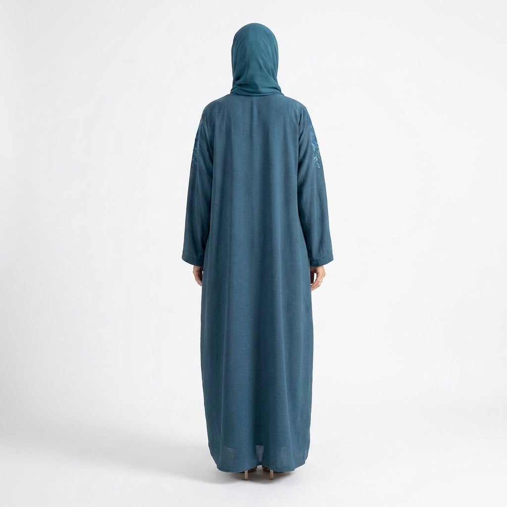 Full-length view of Ocean Bloom Embroidered Coat in Slate Blue / Petrol Teal base with Aqua & Turquoise threadwork